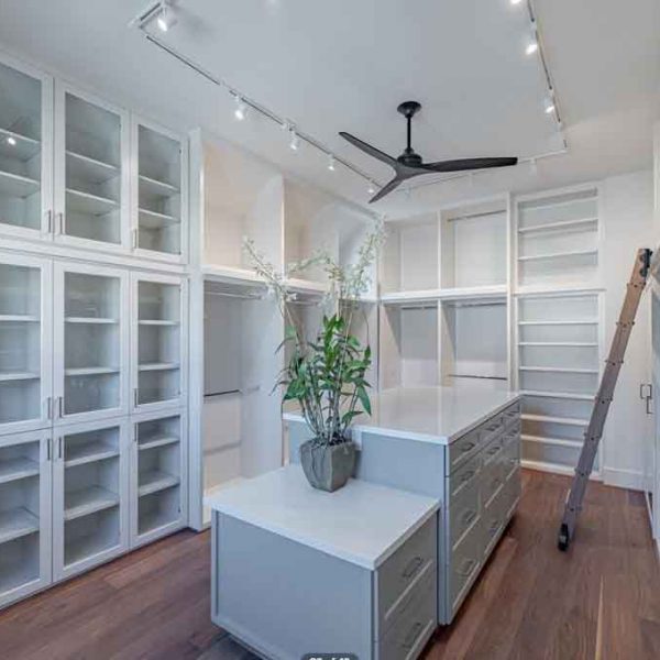 A huge wardrobe area with all white paint