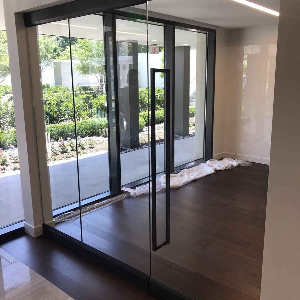 A living room with glass wall
